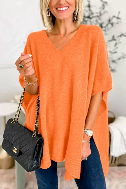 Women's loose fit soft knit poncho top in neutral tone with V-neck draped design for fall layering