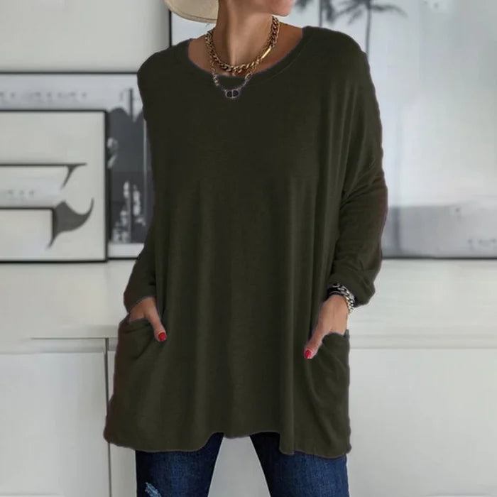 Women's oversized long sleeve tunic top with front pockets, relaxed knit fit and flared hem