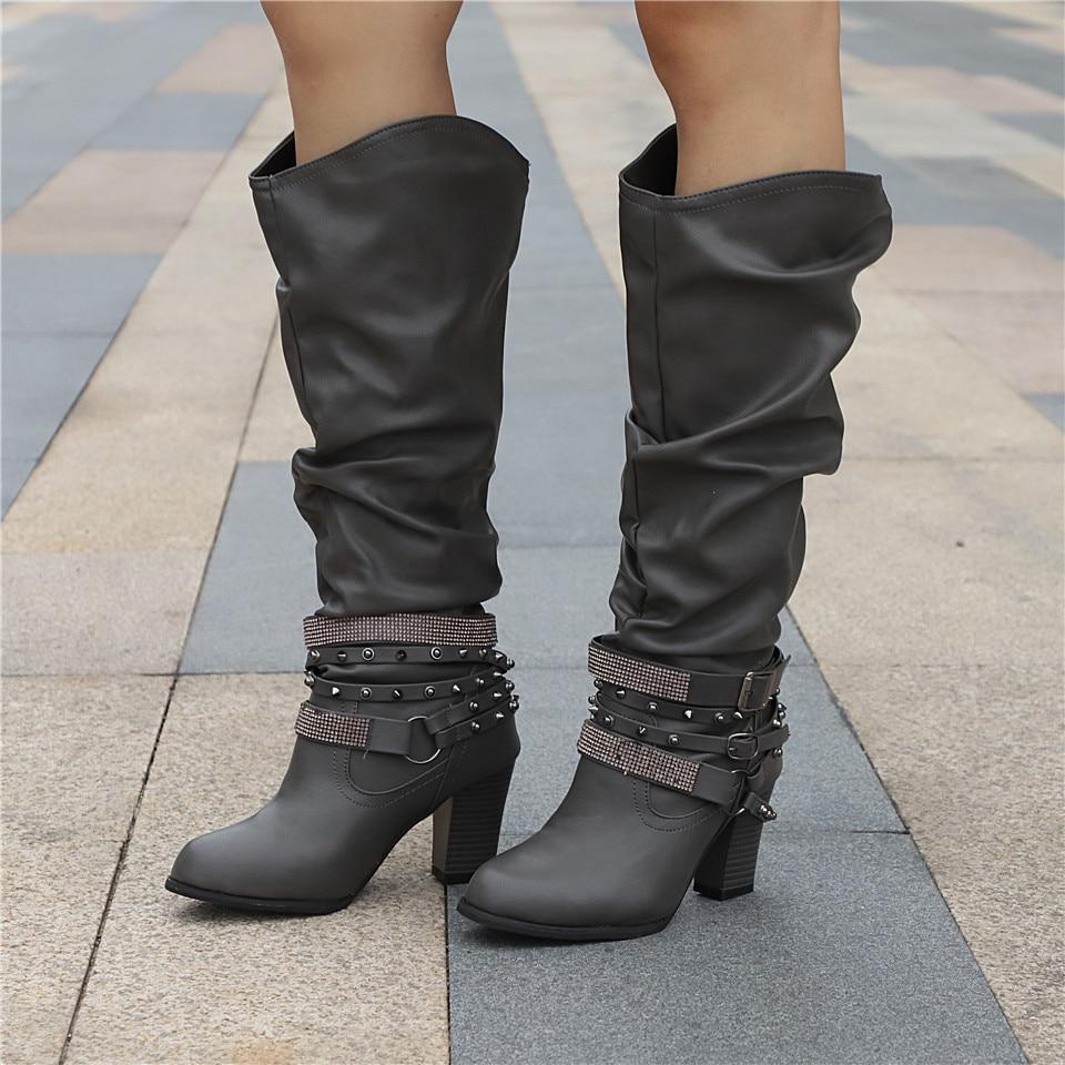 Women's black slouchy knee-high boots with block heel, relaxed leg-lengthening silhouette