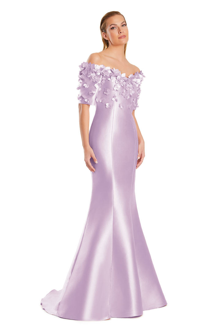 Long mermaid evening gown with floral applique, off-shoulder neckline, and dramatic flared hem
