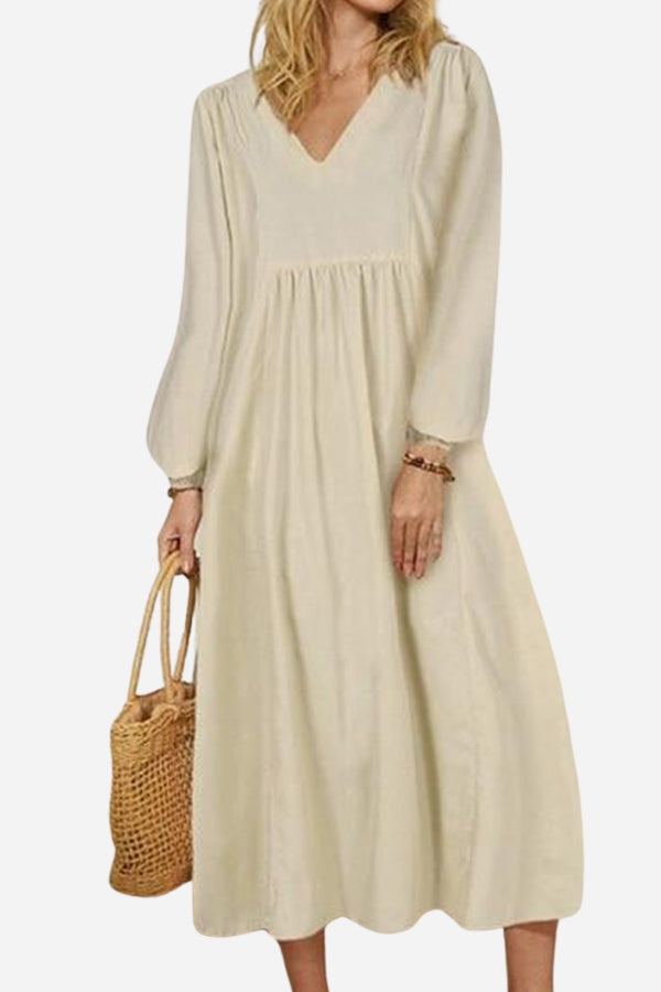 Terracotta midi dress with V-neck, smocked waist, and balloon sleeves for a relaxed, flowing silhouette