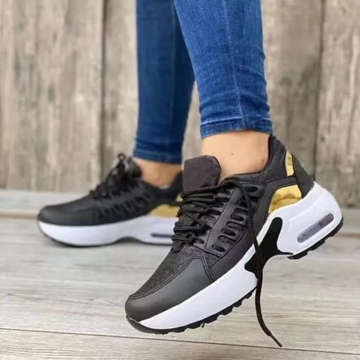 Women's chunky platform sneakers in white with gold-accented midsole, lace-up closure, breathable mesh upper