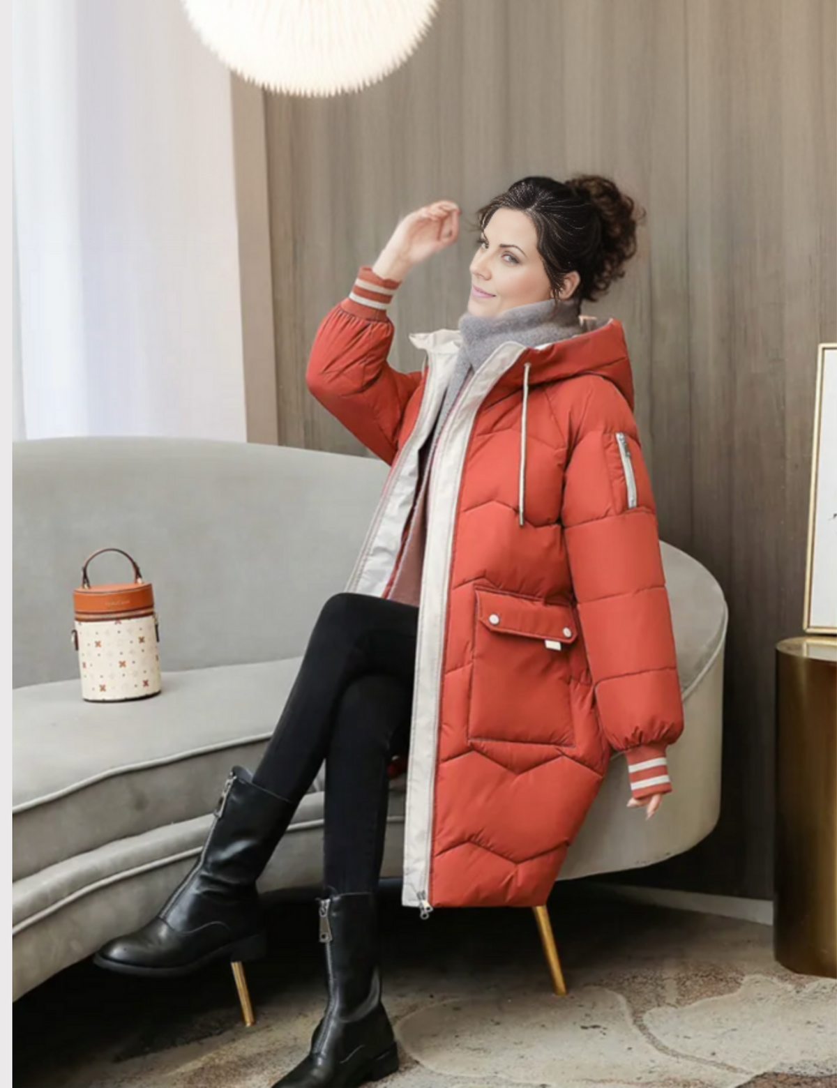 Women's long insulated winter coat in neutral tone, casual sleek silhouette with mid-length warm design