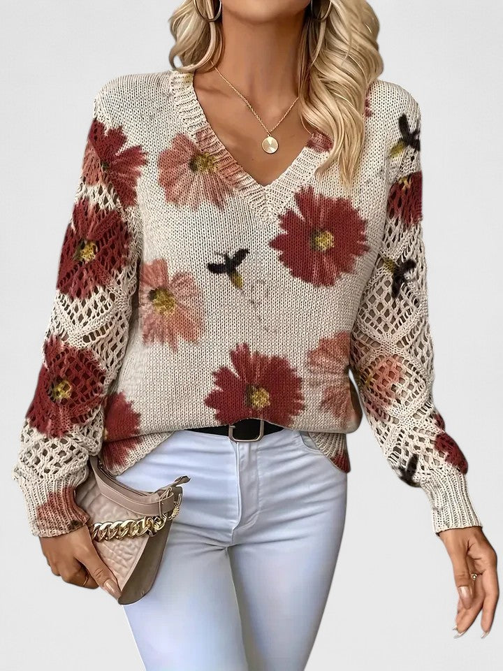 Elegant lightweight floral pattern sweater in soft feminine colors with cozy slim-fit silhouette