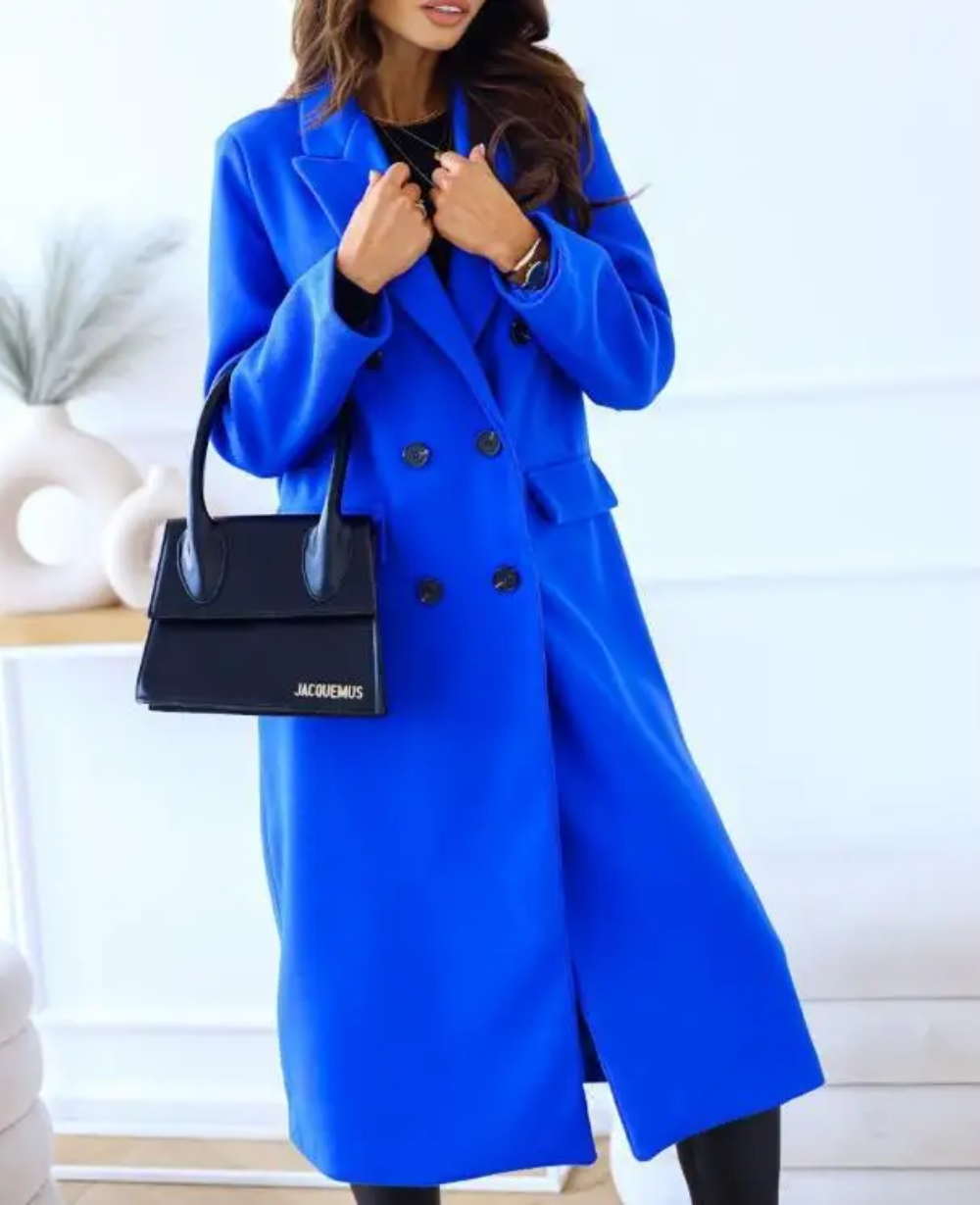 Beige fitted double-breasted trench coat with notched lapel and tailored silhouette