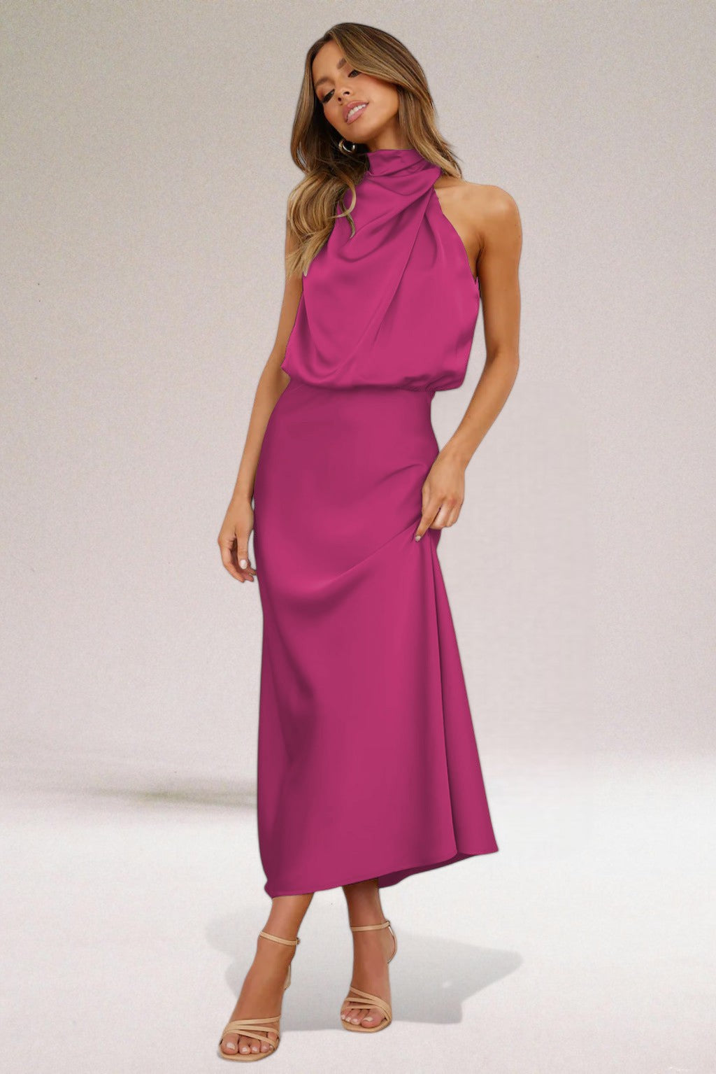 Sleeveless halter neck evening dress in elegant silhouette with radiant finish for special occasions