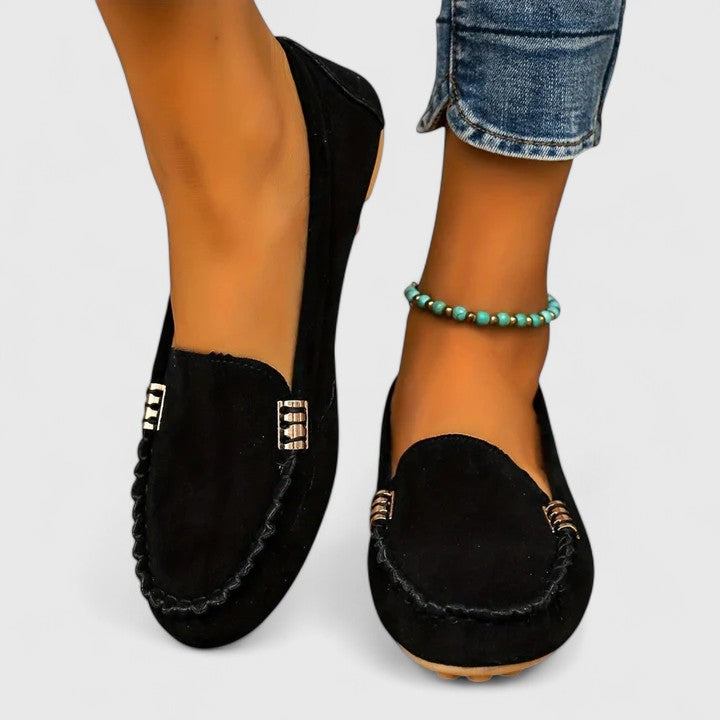 Women's fuchsia suede slip-on loafer flats with classic moccasin silhouette and bold color pop