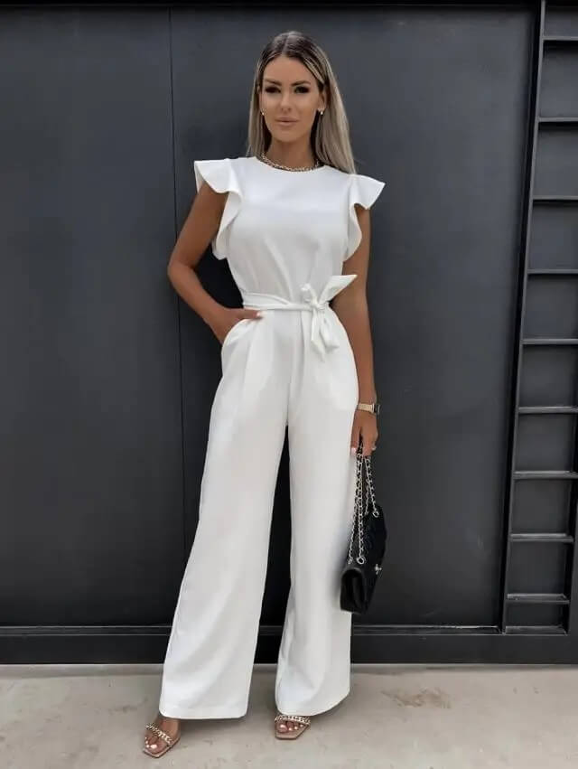 Champagne wide-leg belted jumpsuit with ruffle cap sleeves, elegant floor-length tailored silhouette