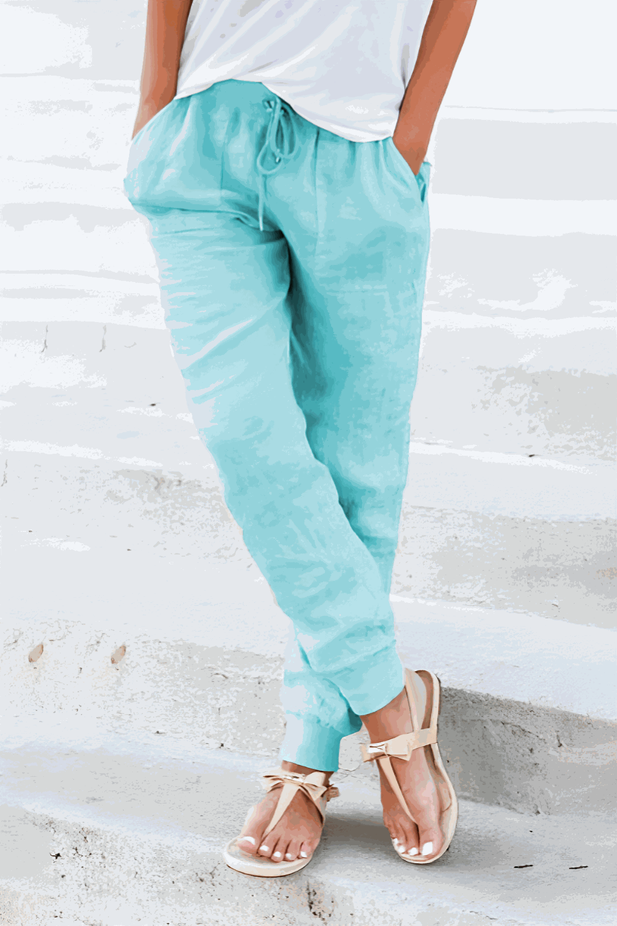 Tan women's tapered jogger pants with drawstring waist and elasticated ankle cuffs