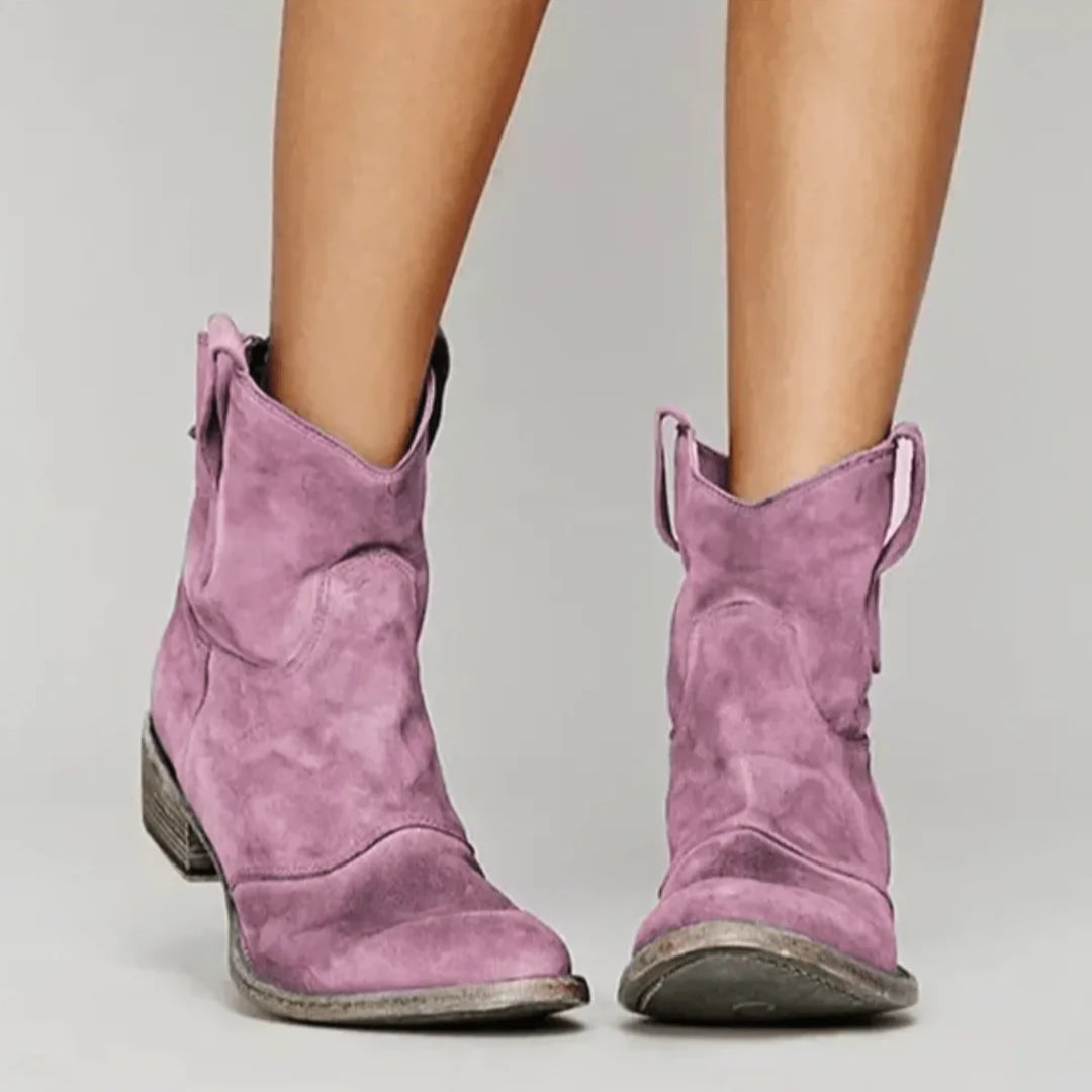 Soft blue suede Western curve boots with sculpted silhouette and practical pull tabs for easy wear