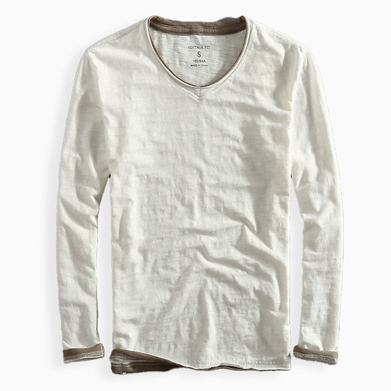 Men's navy slim fit long sleeve V-neck tee with contrast trim and subtle slub texture