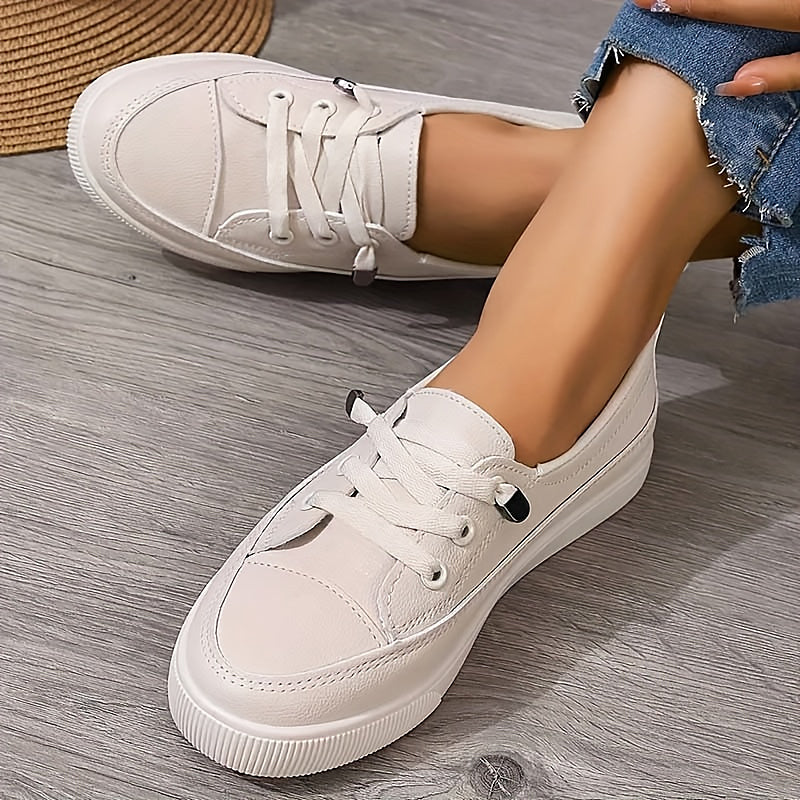 Women's white faux leather low-top lace-up sneaker with clean minimal design for everyday wear