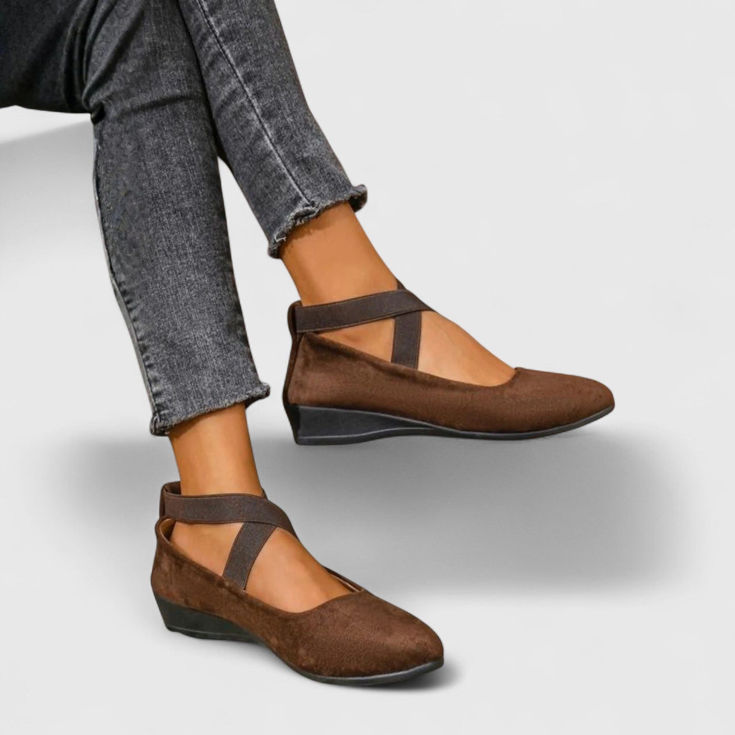 Women's black suede cross-strap wedge flats with hidden low wedge and stretchy strap design
