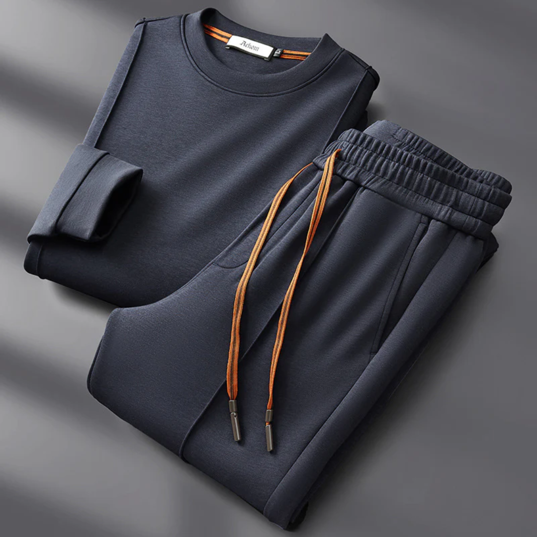 Henry Cotton tracksuit set in neutral tones, minimalist crew-neck sweatshirt and straight-leg trousers with contrast drawstri