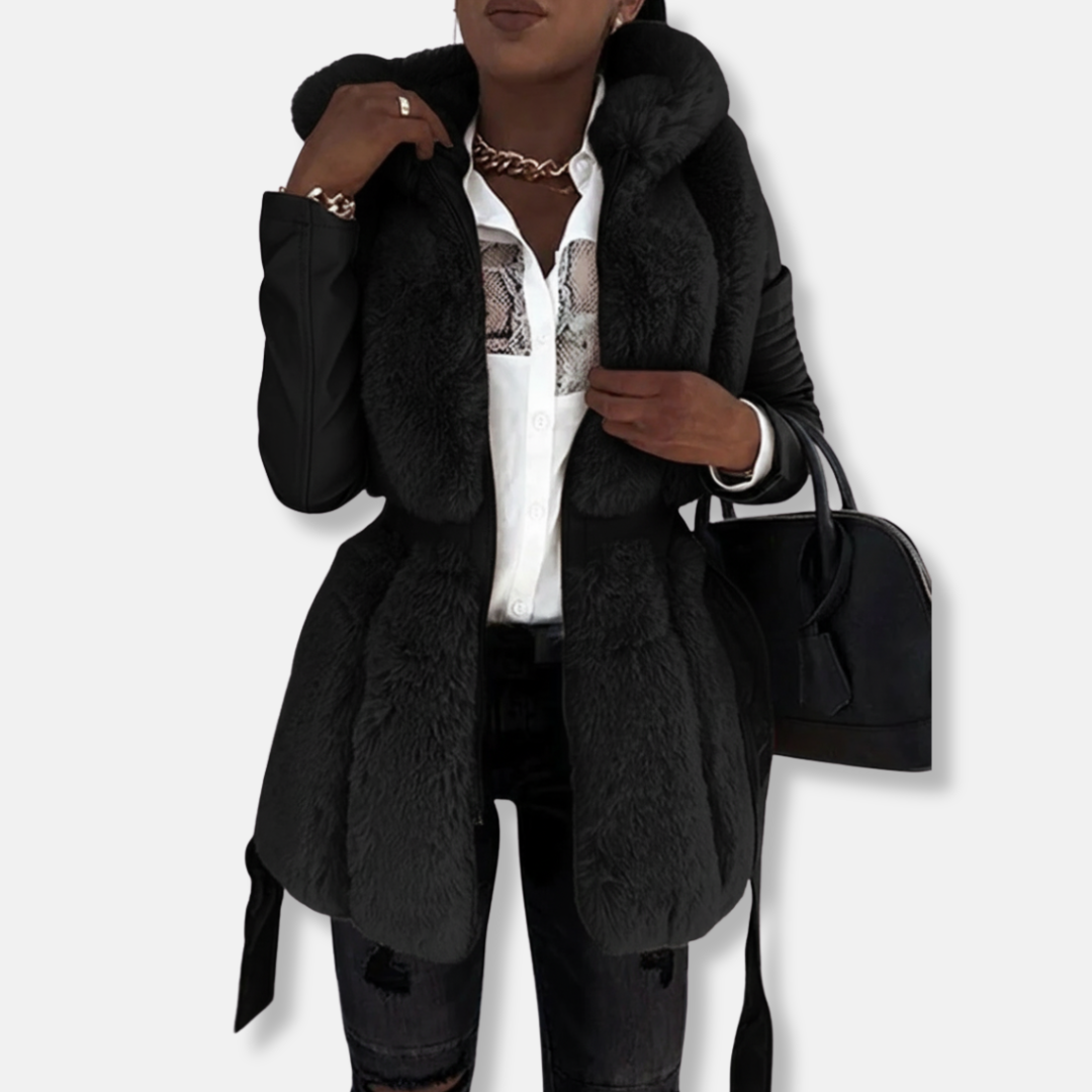 Women's black faux leather tailored jacket with faux fur collar, quilted sleeves, and belted waist
