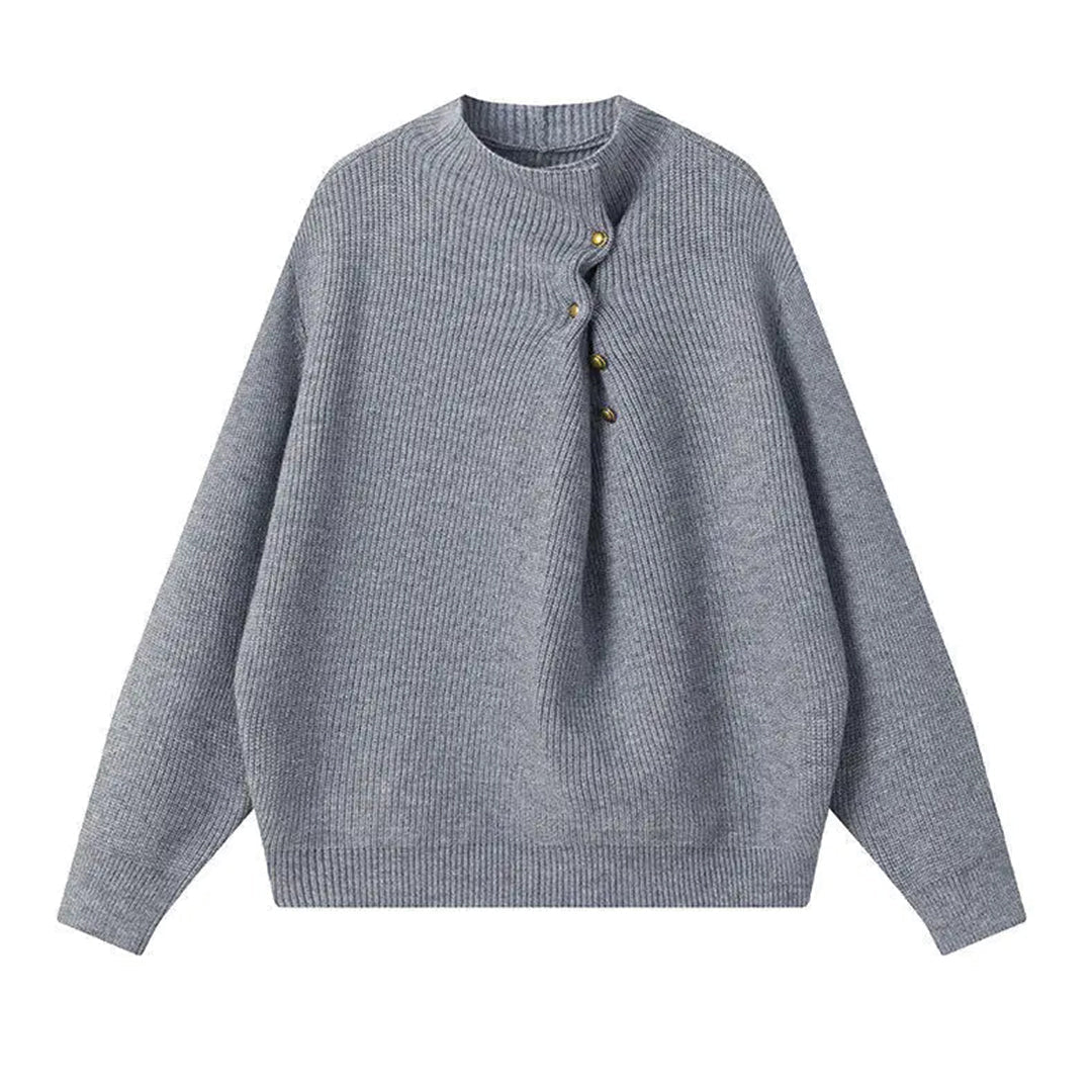 Cachette loose fit knitted sweater with offset button line and ribbed hem in neutral tones
