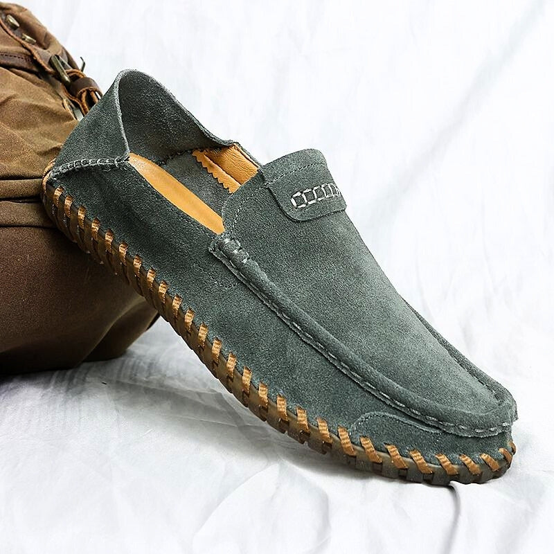 Men's suede slip-on loafers in neutral tone, hand-stitched detailing, flexible summer comfort design