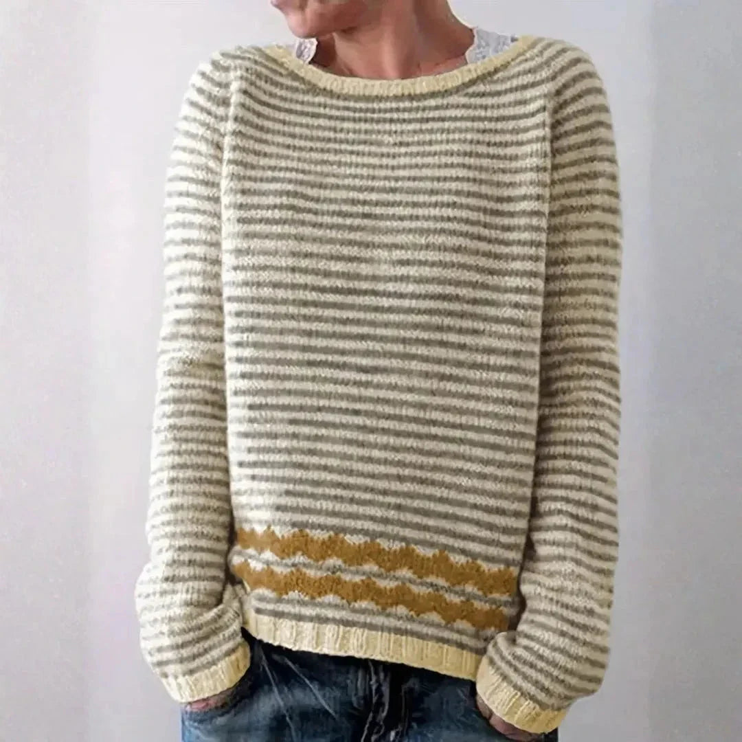 Lulu striped knit sweater with relaxed fit, ribbed cuffs, and contrast wave hem detail