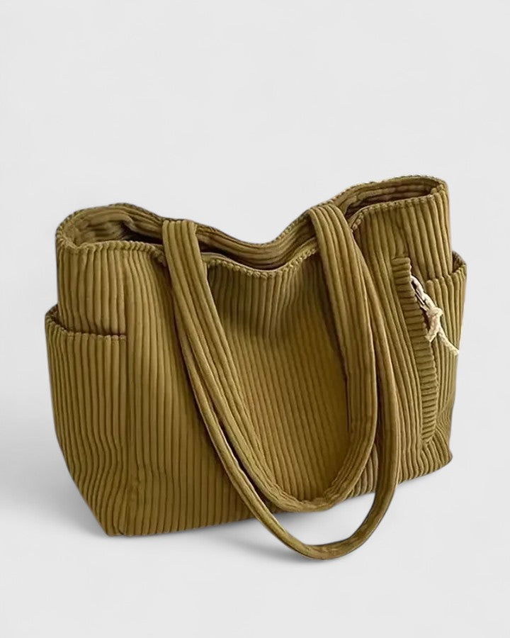 Luxurious ribbed texture handbag in sleek modern design with spacious structured silhouette