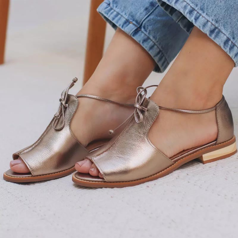 Women's pewter metallic flat sandals with open toe and delicate bow-tie side strap