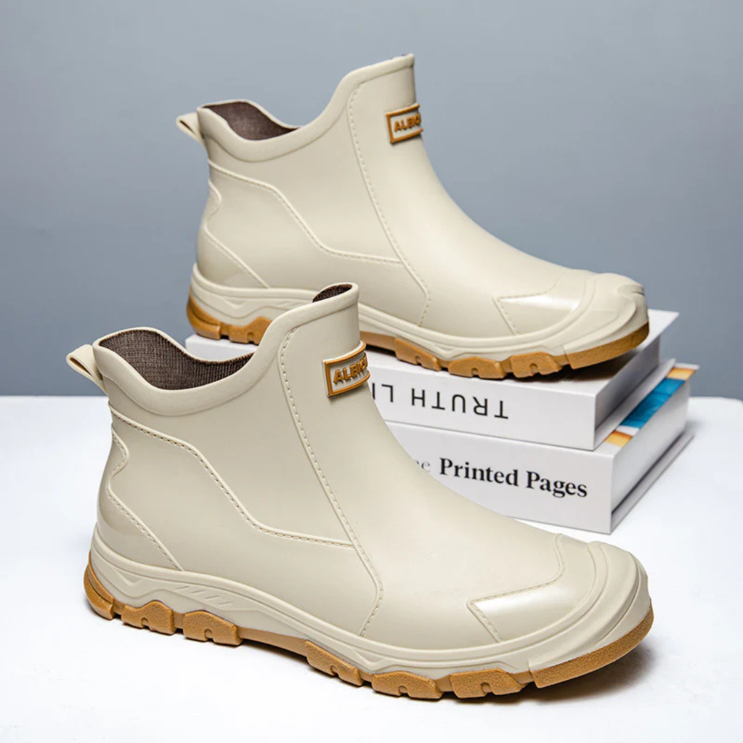 Men's waterproof ankle boots with non-slip tread, pull-on design for all-weather comfort and style
