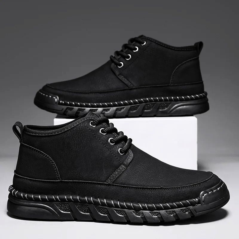 Black Outlandis work boots with weather-resistant finish, cushioned support, and durable non-slip soles