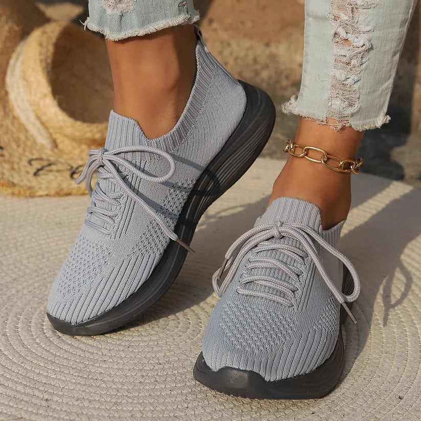 Women's lightweight breathable knit sneakers in neutral tones, minimalist casual silhouette with airy upper