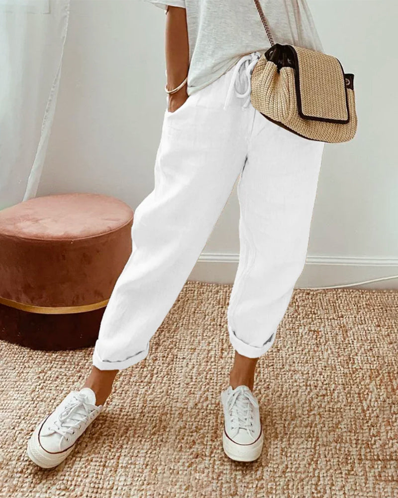 Casual elegant high-waist trousers with soft waistband and flowing breathable cut for effortless style