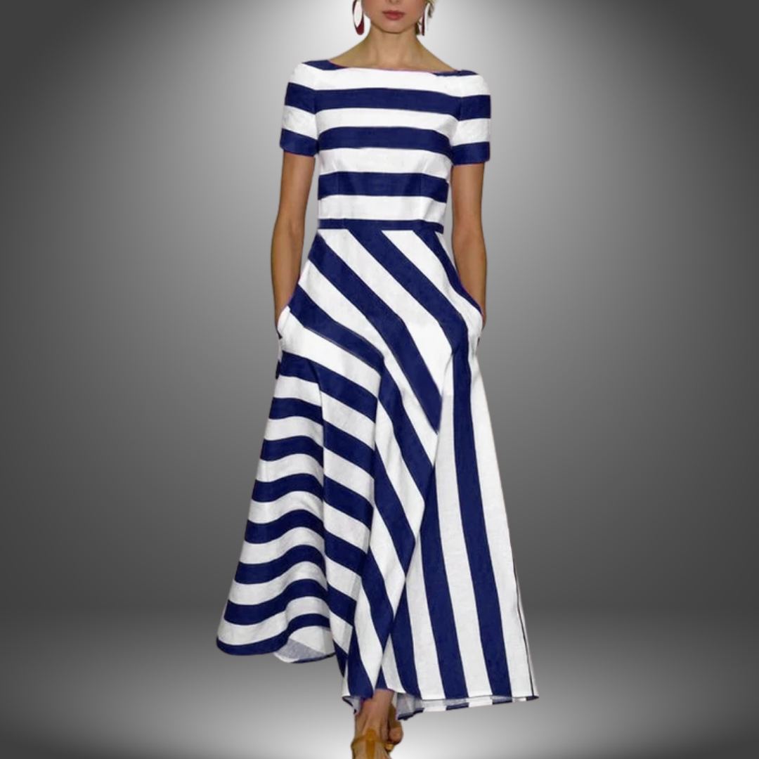 Handcrafted striped maxi dress with flowing silhouette and artisan detailing, relaxed flattering fit