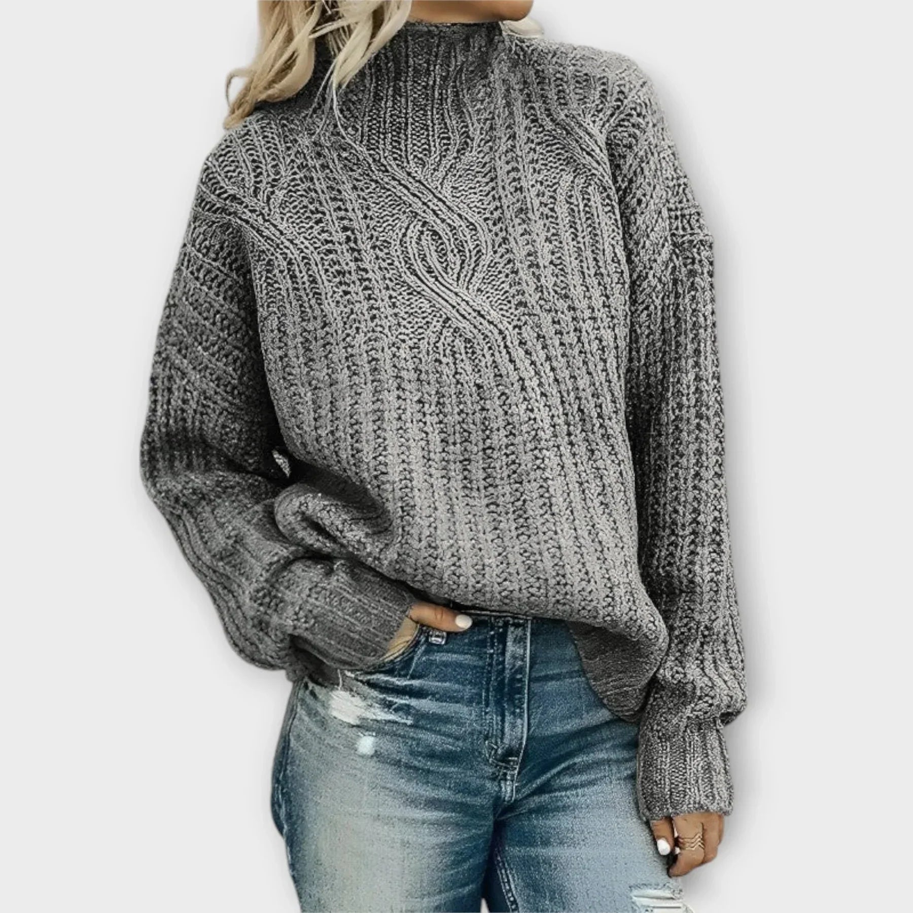 Beige cable-knit high-neck sweater with relaxed silhouette and textured knit pattern