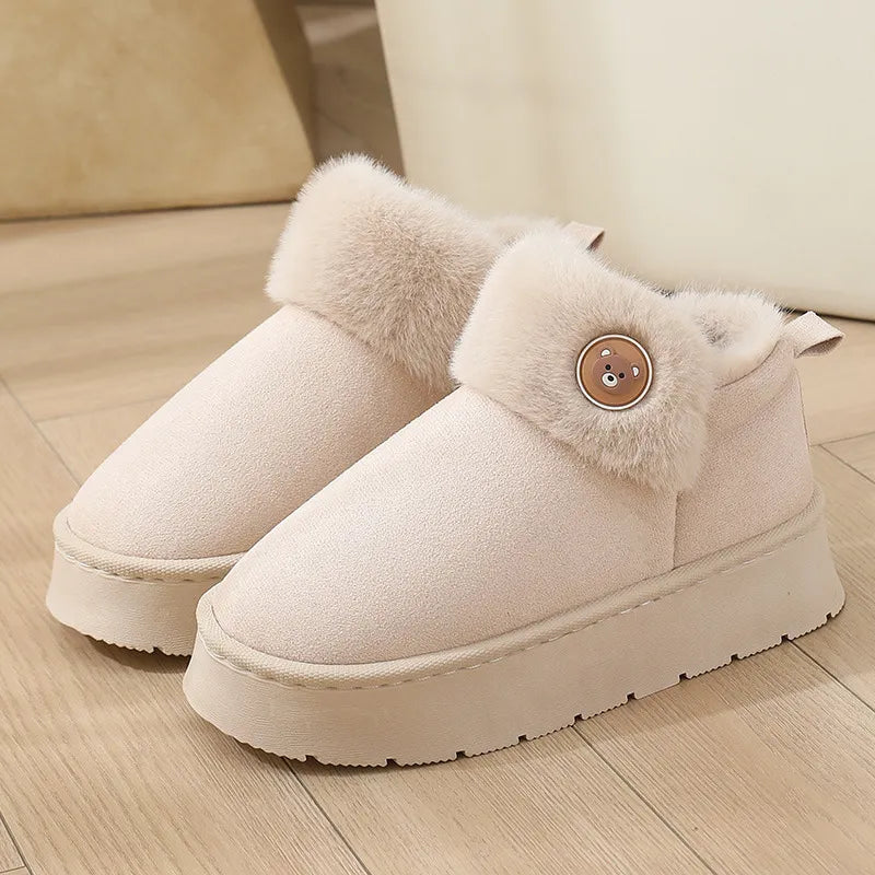 Beige ankle slipper boots with faux fur trim, button detail, and plush fleece interior