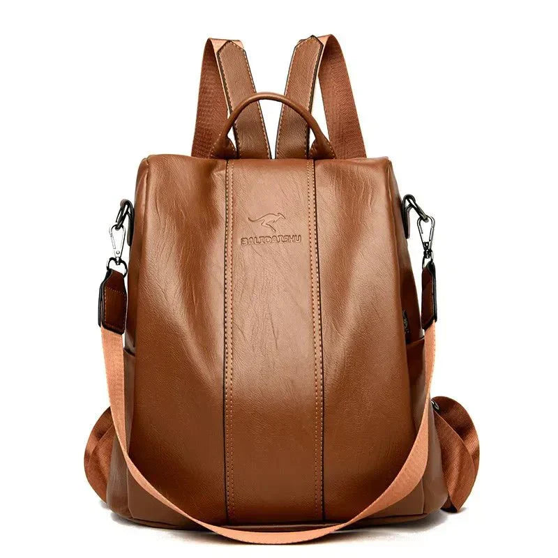 Black vegan leather convertible backpack handbag with top handle, crossbody and shoulder strap options