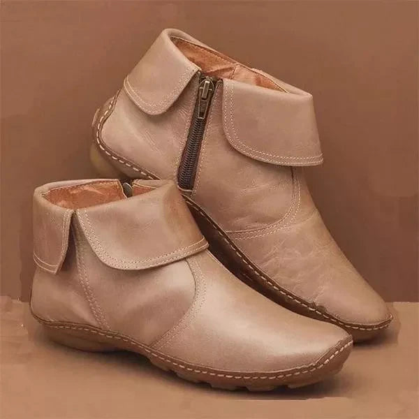 Women's classic black ankle boots with streamlined silhouette and non-slip cushioned sole for all-day comfort