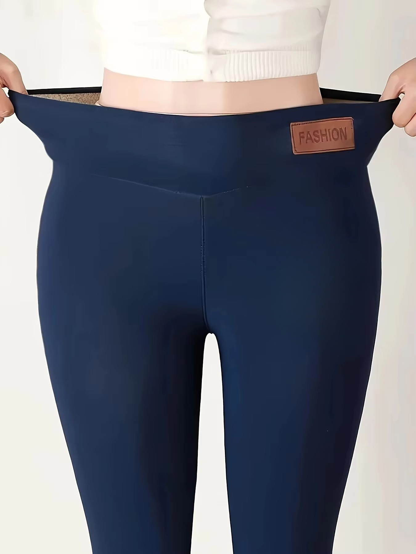 Women's black high-waist thermal plush leggings with fleece-lined interior for cold weather
