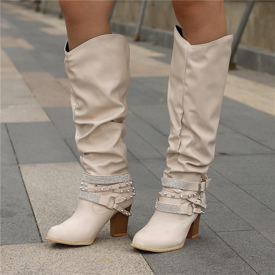 Women's black slouchy knee-high boots with block heel, relaxed silhouette for effortless chic style