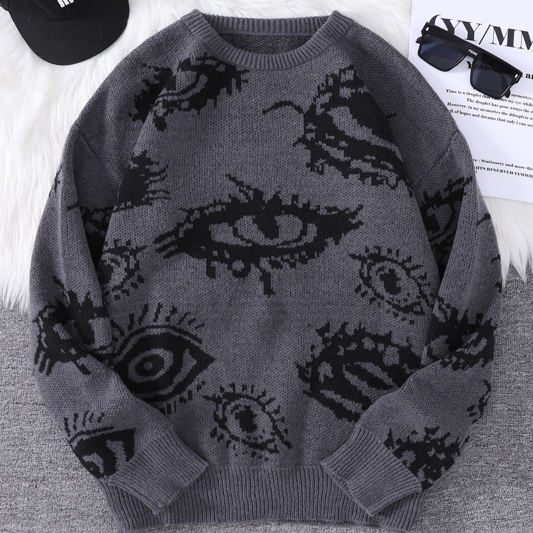 Cream relaxed-fit round-neck knit sweater with bold abstract eye jacquard pattern