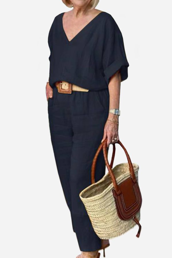 Women's red batwing V-neck top and straight-leg pants matching set with relaxed tailored silhouette