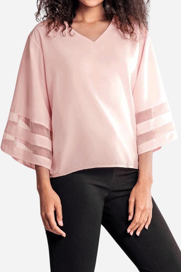 Women's white v-neck blouse with flared bell sleeves and sheer mesh panel inserts