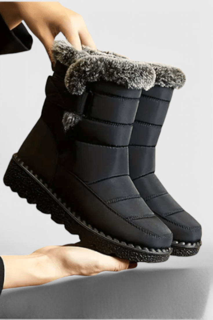 Lexi™ women's black waterproof mid-calf boots with slip-resistant sole and sleek polished silhouette