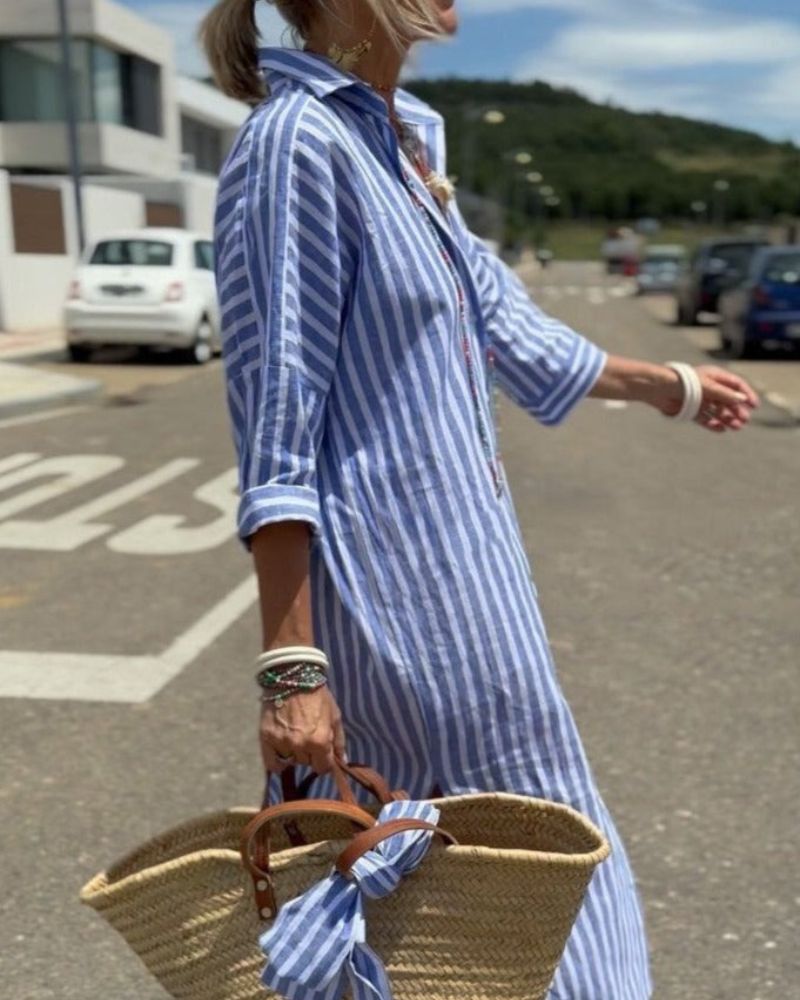 White and navy striped shirt dress with a flattering silhouette and classic button-front design