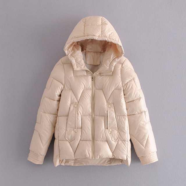 Women's slim-fit black puffer coat with quilted panels, cozy warmth, and modern silhouette
