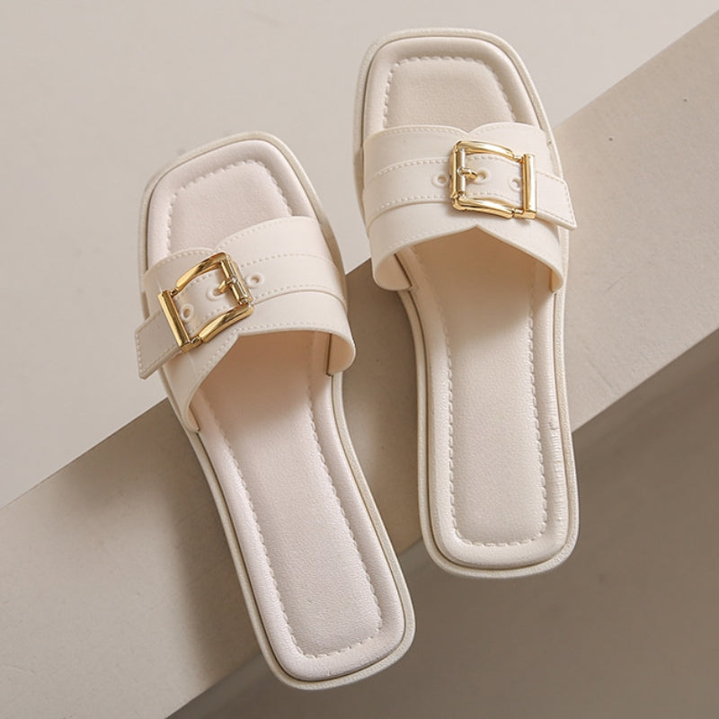 Beige comfort sandals with square toe, curved strap, cushioned sole, and gold-finish hardware