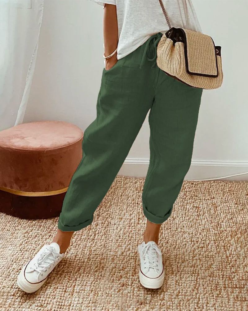 Casual elegant high-waist trousers with soft waistband and flowing breathable cut for effortless style