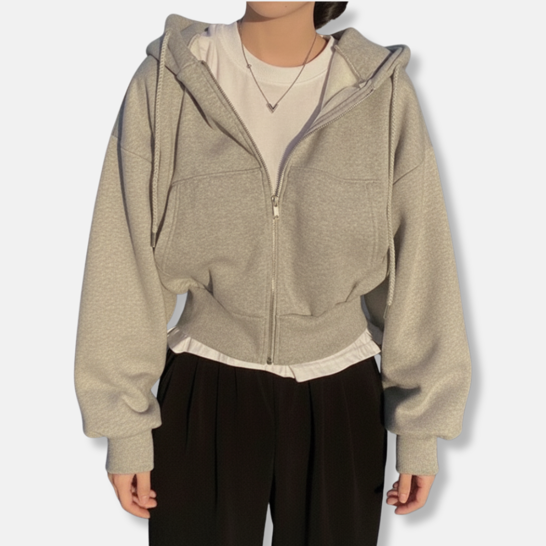 Women's oversized zip-up hoodie in neutral fleece-lined fabric with kangaroo pocket and relaxed fit