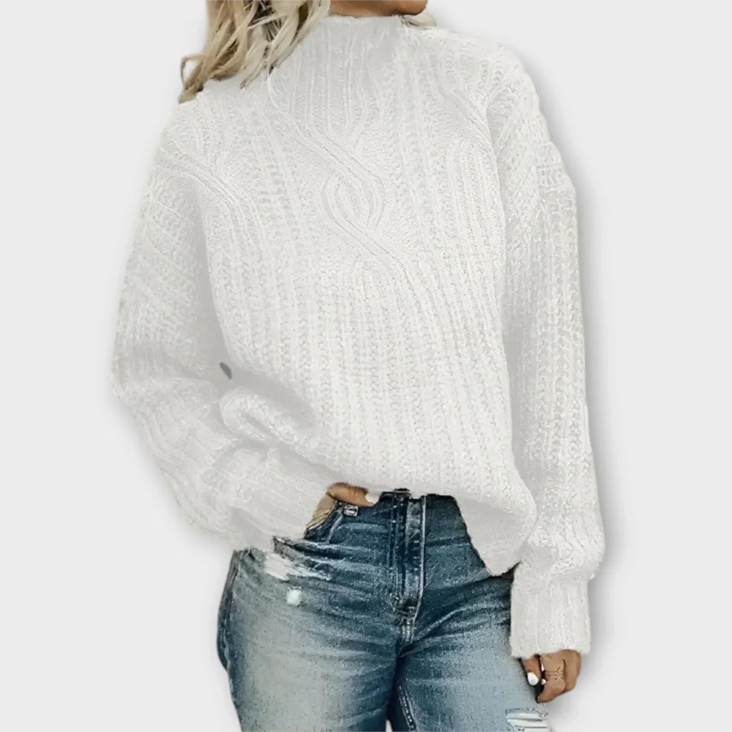 Beige cable-knit high-neck sweater with relaxed silhouette and intricate textured pattern