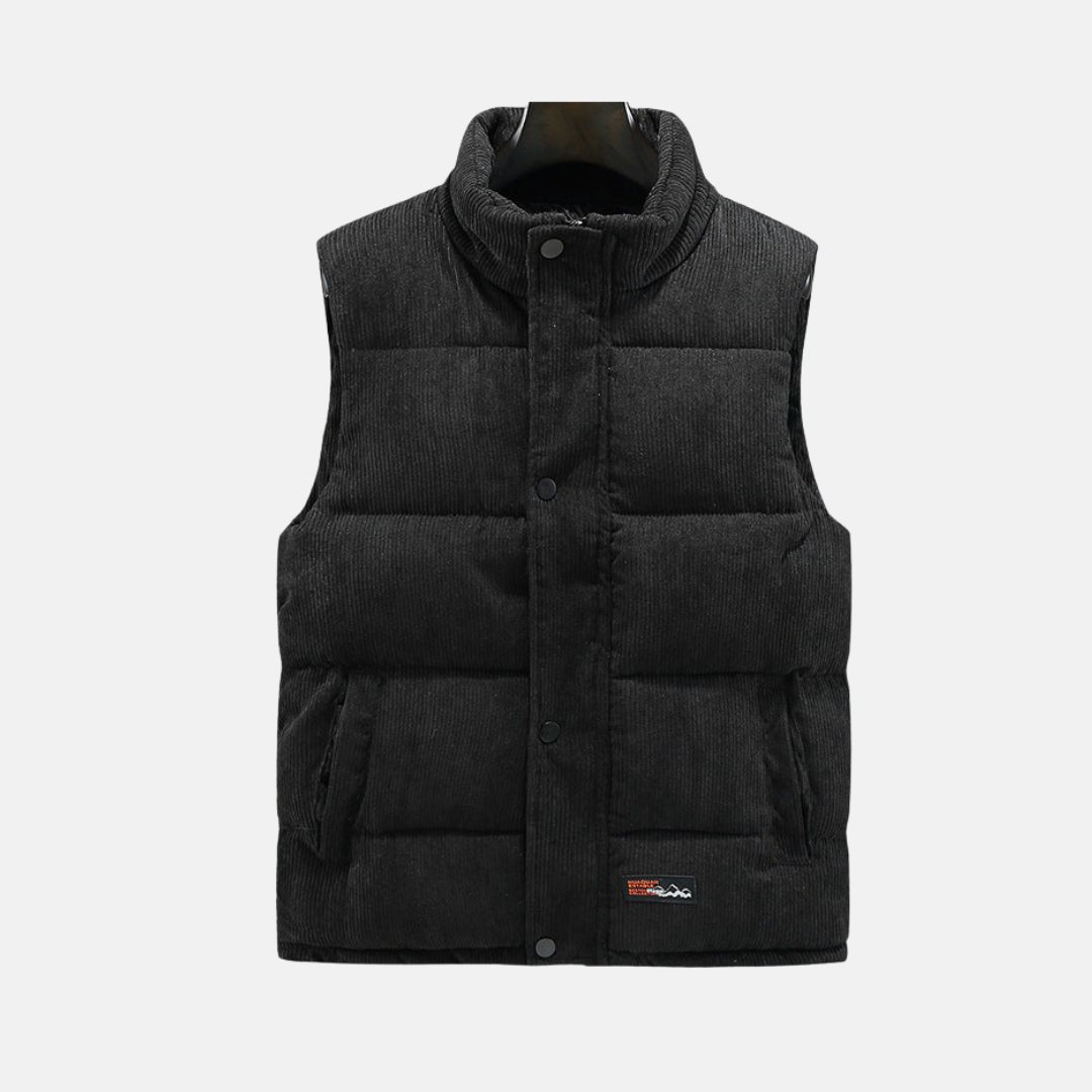 Men's navy corduroy quilted vest with high collar and snap front closure for casual winter layering