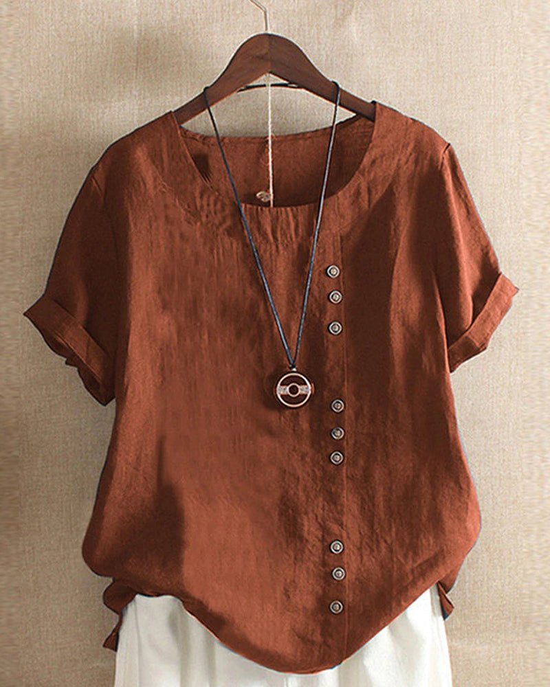 Women's relaxed linen top with crew neck, button front placket, cuffed short sleeves, and curved hem