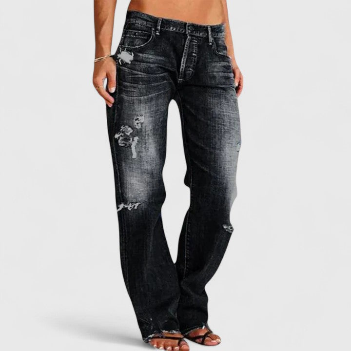 Women's low rise straight leg distressed jeans with authentic rip-and-fade denim detailing