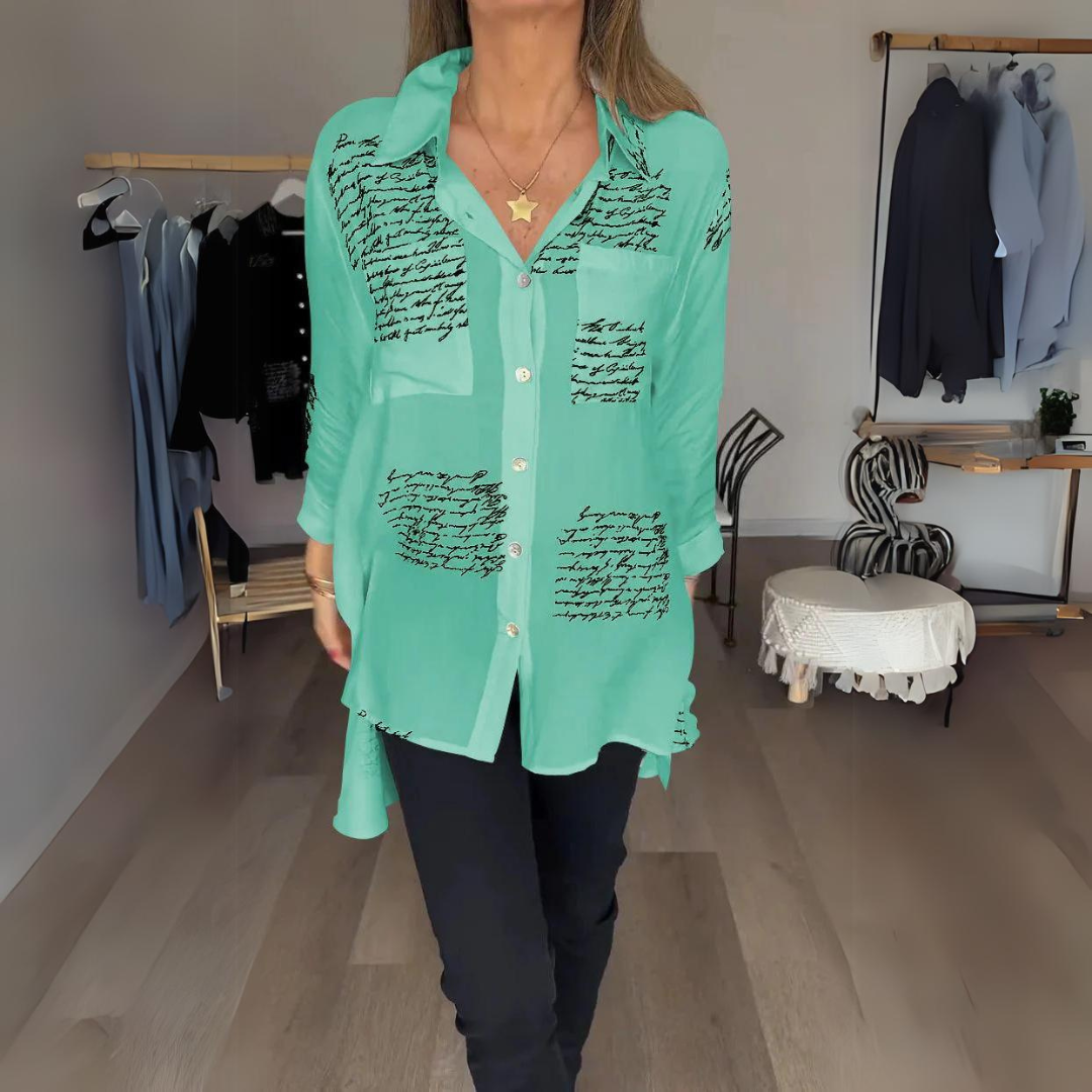 White relaxed button-up shirt with artistic handwritten script print, classic tailoring with playful twist