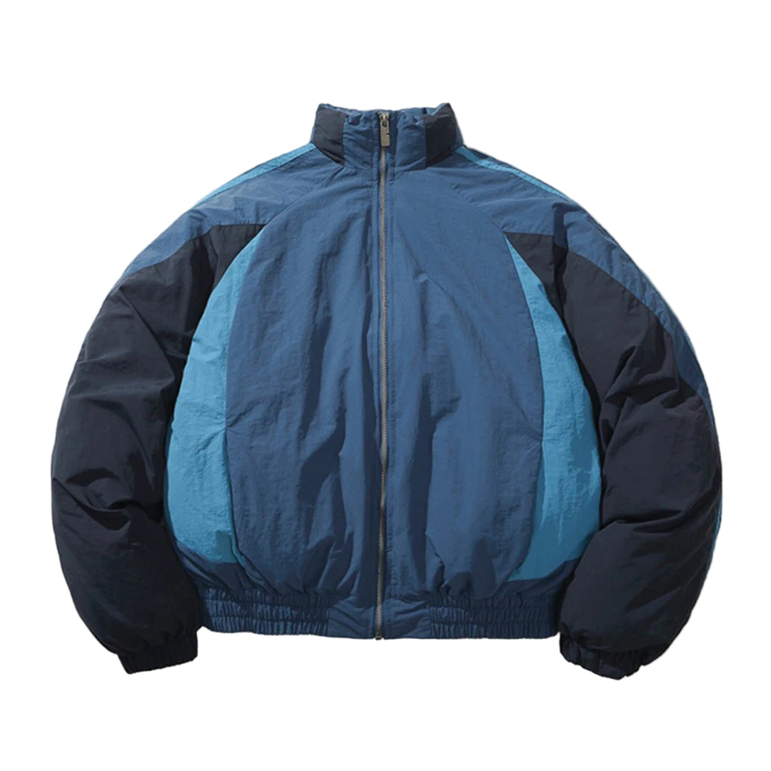 Black and white colorblocked nylon jacket with curved panel seams, oversized fit, and detachable hood